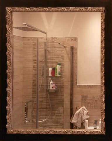 Specchiera nera con bordo argentato invecchiato